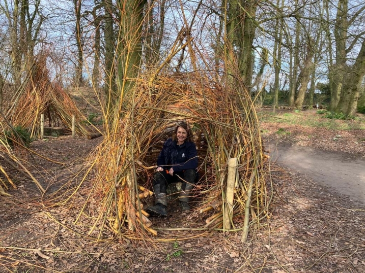 WWT Staff member in a giant den.